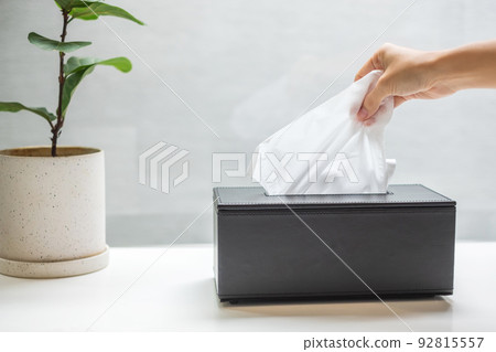 hand pulling toilet paper in bathroom. Cleaning, Lifestyle and personal hygiene concept 92815557