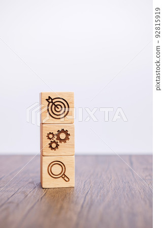wood block with business goal, strategy, target, mission, action, objective, teamwork, brainstorm and idea concept 92815919