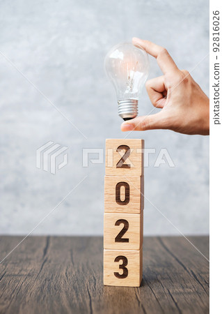 2023 block with lightbulb. Business Idea, Creative, Thinking, brainstorm, Goal, Resolution, strategy, plan, Action, change and New Year start concepts 92816026
