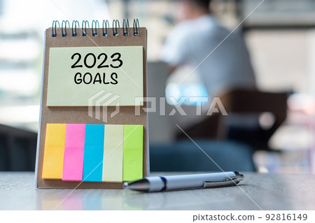 2023 Goal word on note paper with pen on wooden table. Resolution, strategy, solution, goal, business, New Year New You and happy holiday concepts 92816149