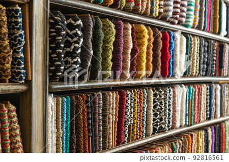 multi-colored braid on the counter of the store for decoration, sewing and needlework 92816561