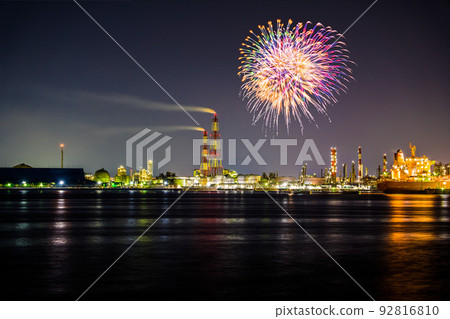 A night view of the Sakai-Semboku coastal industrial area and fireworks that rise up near the anchored ships. composite photo A night view of the Sakai-Semboku coastal industrial area and fireworks that rise up near the anchored ships. composite photo 92816810