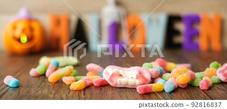 Happy Halloween day with ghost candies, pumpkin bowl, Jack O lantern and decorative selective focus. Trick or Threat, Hello October, fall autumn, Festive, party and holiday concept 92816837