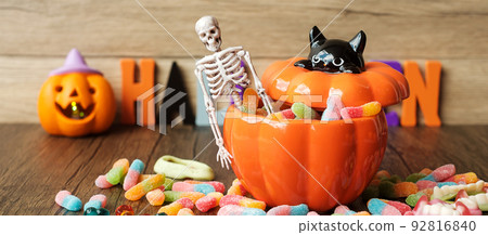 Happy Halloween day with ghost candies, pumpkin bowl, Jack O lantern and decorative selective focus. Trick or Threat, Hello October, fall autumn, Festive, party and holiday concept Happy Halloween day with ghost candies, pumpkin bowl, Jack O lantern and decorative selective focus. Trick or Threat, Hello October, fall autumn, Festive, party and holiday concept 92816840