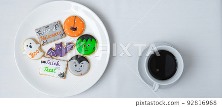 hot coffee cup with funny Halloween Cookies. Happy Halloween day, Trick or Threat, Hello October, fall autumn, Traditional, party and holiday concept 92816968
