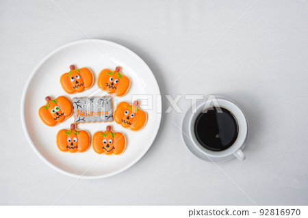 hot coffee cup with funny Halloween Cookies. Happy Halloween day, Trick or Threat, Hello October, fall autumn, Traditional, party and holiday concept 92816970