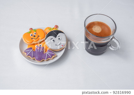 hot espresso coffee  or chocolate cup with funny Halloween Cookies. Happy Halloween day, Trick or Threat, Hello October, fall autumn, Traditional, party and holiday concept 92816990