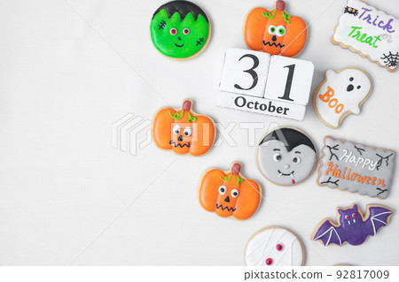 Halloween funny Cookies with 31 October calendar on white background. Trick or Threat, Happy Halloween, Hello October, fall autumn, Festive, party and holiday concept 92817009