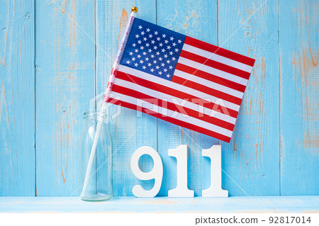 911 text and United States of America flag on wooden table background. Patriot Day, September, memorial and Never Forget concept 911 text and United States of America flag on wooden table background. Patriot Day, September, memorial and Never Forget concept 92817014