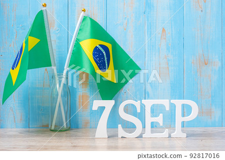 Wooden text of August 7th with miniature Brazil flags. Independence day of Brazil and happy celebration concepts Wooden text of August 7th with miniature Brazil flags. Independence day of Brazil and happy celebration concepts 92817016