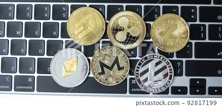 golden and silver Cryptocurrency on keyboard laptop, Bitcoin , Ethereum, Litecoin, Dash, Monero, Zcach and Ripple coins. Crypto is Digital Money within the blockchain network golden and silver Cryptocurrency on keyboard laptop, Bitcoin , Ethereum, Litecoin, Dash, Monero, Zcach and Ripple coins. Crypto is Digital Money within the blockchain network 92817199