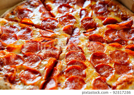 close up. a piece of pizza out of the box. close up. a piece of pizza out of the box. 92817286