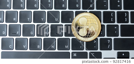 golden Cryptocurrency on keyboard laptop, Ripple coin. Crypto is Digital Money within the blockchain network golden Cryptocurrency on keyboard laptop, Ripple coin. Crypto is Digital Money within the blockchain network 92817416