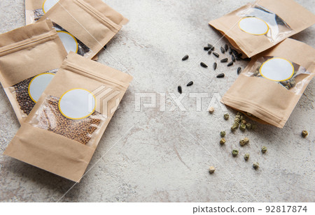 Microgreen seeds in paper bags and equipment for sowing microgreens. 92817874