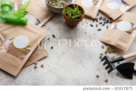 Microgreen seeds in paper bags and equipment for sowing microgreens. 92817875