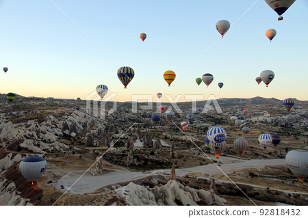 Balloon flight at dawn in Cappadocia, Turkey Balloon flight at dawn in Cappadocia, Turkey 92818432