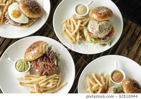 selection of many different burgers on restaurant table selection of many different burgers on restaurant table 92818944