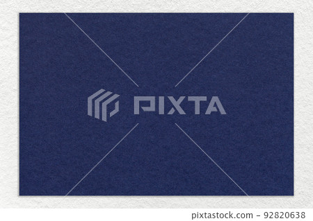 Texture of craft navy blue color paper background with white border, macro. Vintage dense kraft denim cardboard Texture of craft navy blue color paper background with white border, macro. Vintage dense kraft denim cardboard 92820638