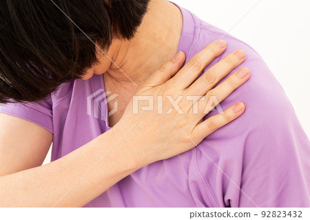 Middle woman suffering from stiff shoulders Middle woman suffering from stiff shoulders 92823432