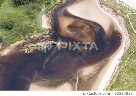 Aerial of the mouth of the Fintragh river at Fintra beach by Killybegs, County Donegal, Ireland Aerial of the mouth of the Fintragh river at Fintra beach by Killybegs, County Donegal, Ireland 92823882