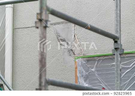 Construction site exterior wall repair work Construction site exterior wall repair work 92823965