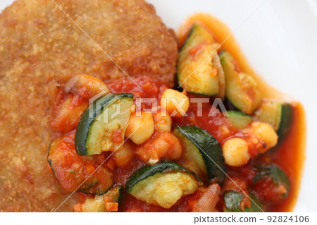 Pork cutlet with chunky vegetables and tomato sauce Pork cutlet with chunky vegetables and tomato sauce 92824106