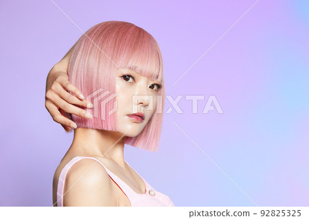Beauty portrait of young woman with pink hair 92825325