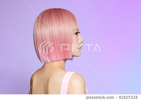 Beauty portrait of young woman with pink hair 92825328