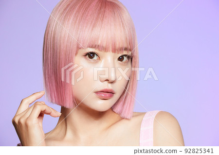 Beauty portrait of young woman with pink hair Beauty portrait of young woman with pink hair 92825341