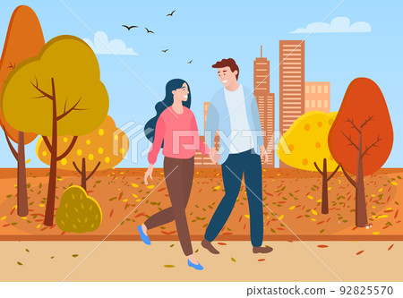 Man and Woman Walking Together in Autumn Park Man and Woman Walking Together in Autumn Park 92825570