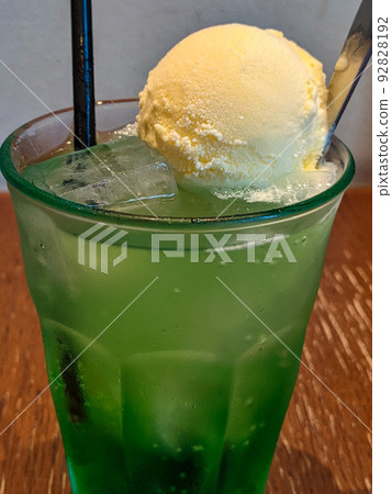 Melon soda float at a nostalgic taste cafe Melon soda float at a nostalgic taste cafe 92828192