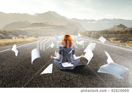Beautiful businesswoman meditating . Mixed media Beautiful businesswoman meditating . Mixed media 92828668