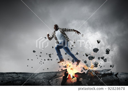 Determined businessman on his way to success leaving fire trails Determined businessman on his way to success leaving fire trails 92828678