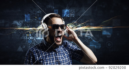 Young man with headphones . Mixed media 92829208