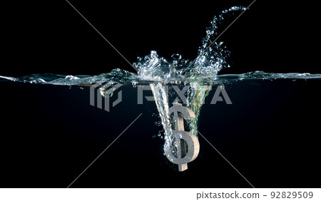 Sign of us dollar in water splashes Sign of us dollar in water splashes 92829509