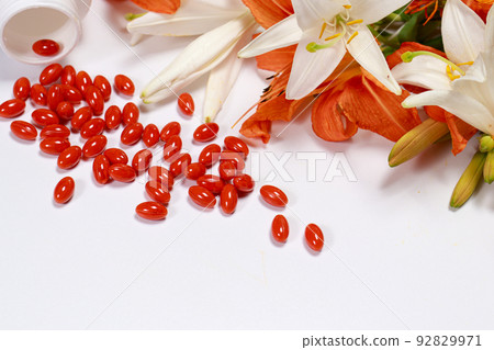 Banner with bioadditive tablets and medicinal plants with place for text copy space. Lutein, herbal medicine pills Banner with bioadditive tablets and medicinal plants with place for text copy space. Lutein, herbal medicine pills 92829971
