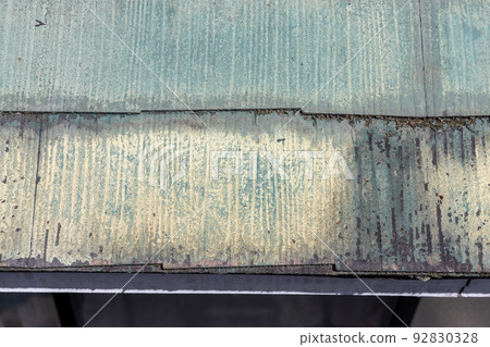 The faded and dirty roof of a 25-year-old detached house The faded and dirty roof of a 25-year-old detached house 92830328