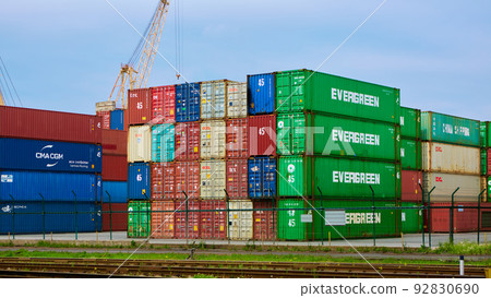 Odessa, Ukraine - May 19, 2021: Freight containers in the port terminal. Containers labeled Evergreen in the foreground. Odessa, Ukraine - May 19, 2021: Freight containers in the port terminal. Containers labeled Evergreen in the foreground. 92830690