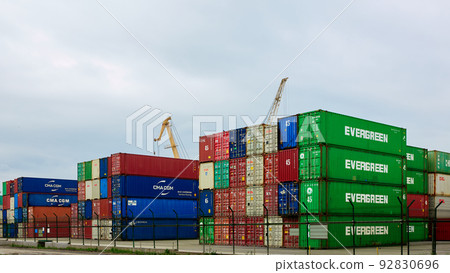 Odessa, Ukraine - May 19, 2021: Freight containers in the port terminal. Containers labeled Evergreen in the foreground. 92830696