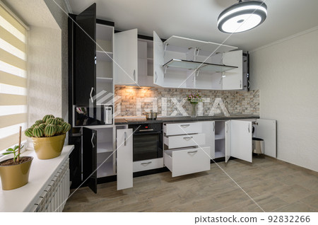 Renovated Interior for modern trendy white kitchen with doors open Renovated Interior for modern trendy white kitchen with doors open 92832266