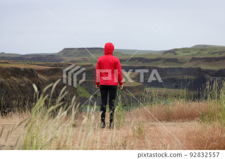 Woman Hiker at American Nature Landscape during cloudy day Woman Hiker at American Nature Landscape during cloudy day 92832557