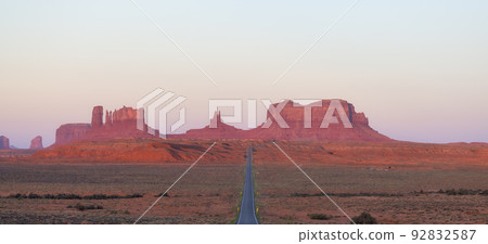 Scenic Road in the Dry Desert with Red Rocky Mountains in Background. Scenic Road in the Dry Desert with Red Rocky Mountains in Background. 92832587