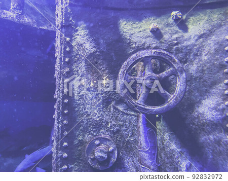 sunken submarine. the faucet and lid were covered with rust and moss from long exposure to water. the metal sank due to the wreck sunken submarine. the faucet and lid were covered with rust and moss from long exposure to water. the metal sank due to the wreck 92832972
