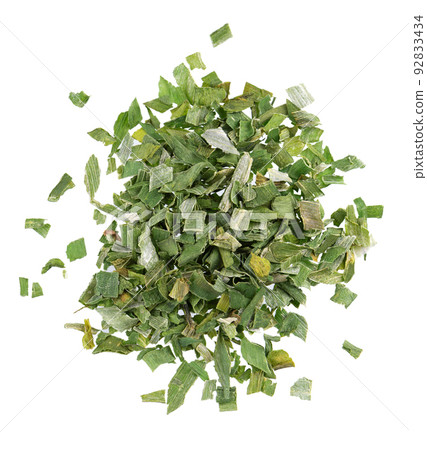 Dry chopped spring onion isolated on white background. Chopped dried green onion or scallion. Spices and herbs. Top view. Dry chopped spring onion isolated on white background. Chopped dried green onion or scallion. Spices and herbs. Top view. 92833434