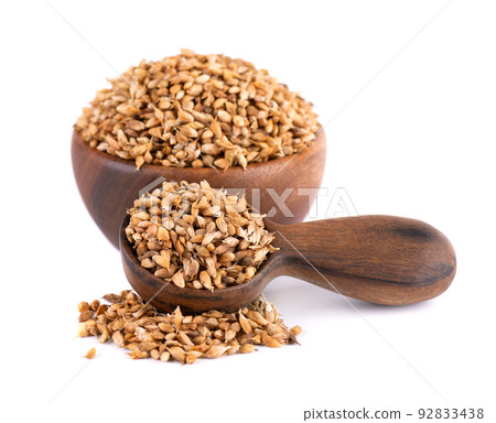 Utsho suneli seeds in wooden bowl and spoon, isolated on white background. Trigonella caerulea or blue fenugreek. 92833438