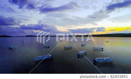 plastic bottles floating on a lake water plastic polluted environment 3D illustration plastic bottles floating on a lake water plastic polluted environment 3D illustration 92833841