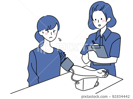A woman having her blood pressure measured and recorded A woman having her blood pressure measured and recorded 92834442