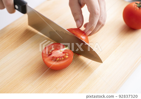 Women's hand cutting vegetables Women's hand cutting vegetables 92837320