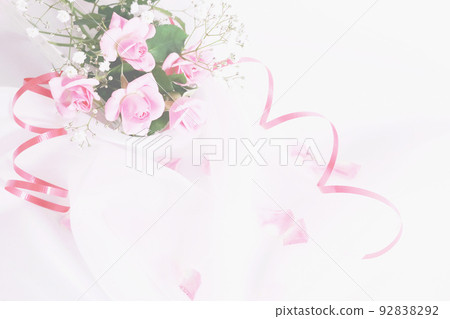Bouquet of pink roses and twigs and falling petals on curled pink ribbon and veil Bouquet of pink roses and twigs and falling petals on curled pink ribbon and veil 92838292