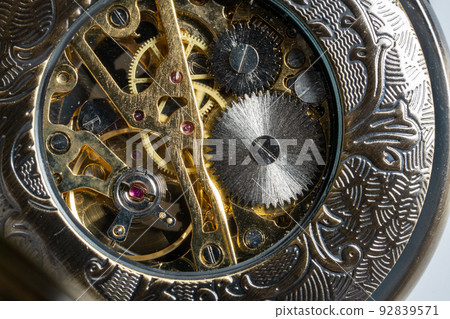 The back side of a skeleton type pocket watch The back side of a skeleton type pocket watch 92839571